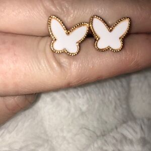 Gold tone white butterfly earrings